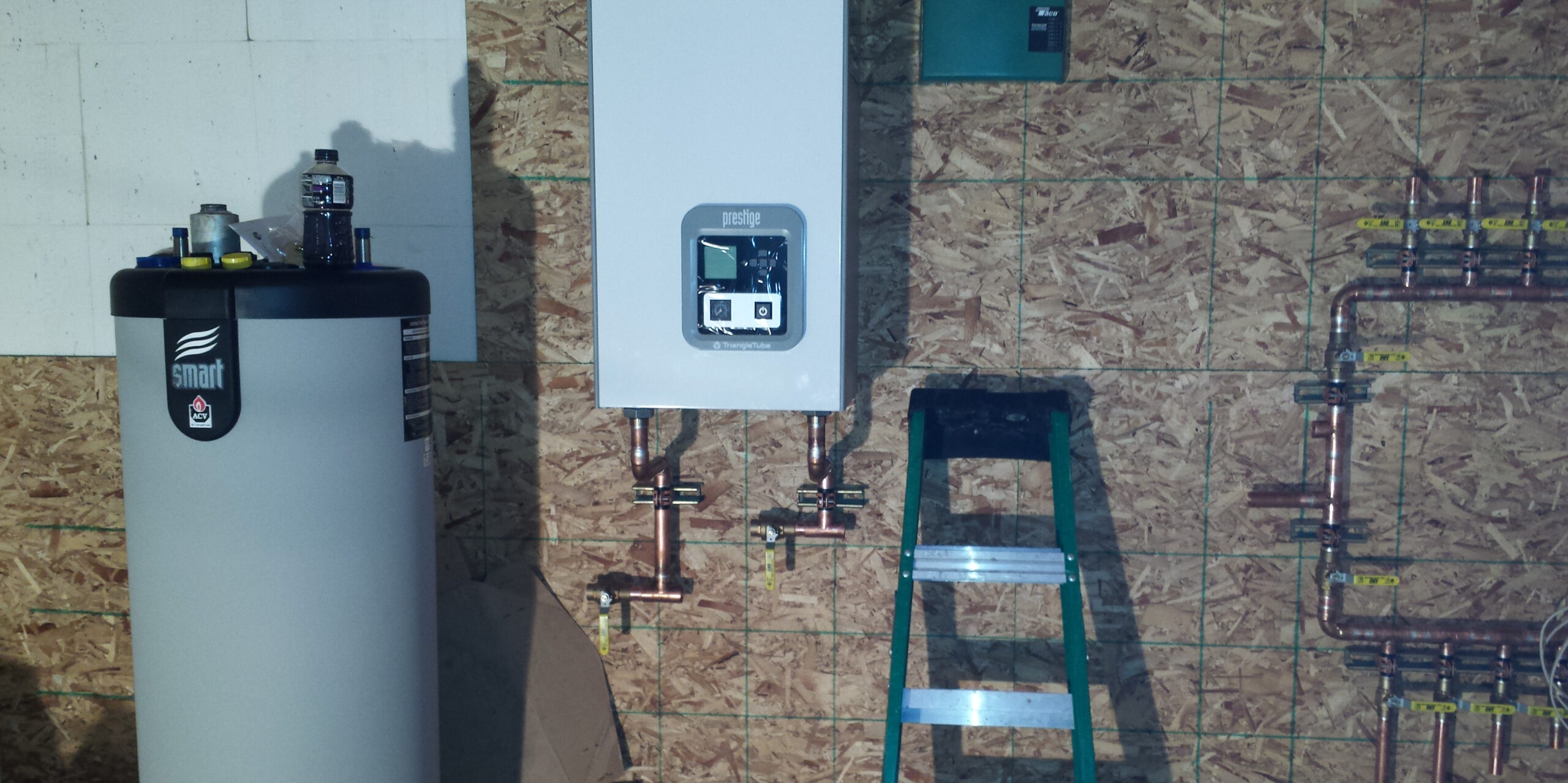 Wall-mounted tankless water heater installed by Prime Plumbing in Billings, MT